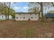 Large backyard area, featuring a two-story home with a painted-white brick exterior at 919 N Weldon St, Gastonia, NC 28052