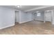 Finished basement showcasing open space and neutral walls with wood-look floors at 919 N Weldon St, Gastonia, NC 28052