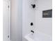 Stylish bathroom features a bathtub, modern tile and black shower fixtures at 919 N Weldon St, Gastonia, NC 28052