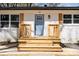 Close-up of the front entrance, highlighting a newly constructed porch with blue door and wooden accents at 919 N Weldon St, Gastonia, NC 28052
