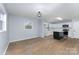 Bright kitchen features new stainless appliances, white cabinets and a central island at 919 N Weldon St, Gastonia, NC 28052
