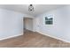 Open-concept living room features natural light and laminate flooring at 919 N Weldon St, Gastonia, NC 28052