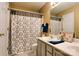 Double vanity bathroom with gray cabinets at 10105 Reindeer Way Ln, Charlotte, NC 28216