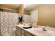 Double vanity bathroom with gray cabinets at 10105 Reindeer Way Ln, Charlotte, NC 28216