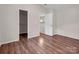 Bedroom with wood floors and access to closet and loft at 10105 Reindeer Way Ln, Charlotte, NC 28216