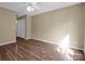 Spacious bedroom with wood floors and ceiling fan at 10105 Reindeer Way Ln, Charlotte, NC 28216