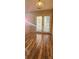 Bright dining area with hardwood floors and French doors at 10105 Reindeer Way Ln, Charlotte, NC 28216