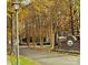 Community entrance with brick sign and trees at 10105 Reindeer Way Ln, Charlotte, NC 28216