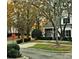 Charming home exterior with autumn foliage and landscaping at 10105 Reindeer Way Ln, Charlotte, NC 28216