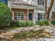 Brick front townhouse with well-maintained landscaping at 10105 Reindeer Way Ln, Charlotte, NC 28216