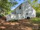 Home's exterior features white siding and a fenced yard at 10105 Reindeer Way Ln, Charlotte, NC 28216