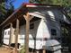 Exterior view of the home, showcasing its covered area and convenient outdoor grill at 127 Deer Park Rd # D16, Mount Gilead, NC 27306
