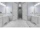 Luxurious bathroom featuring marble floors, dual vanities, and a glass-enclosed shower at 16921 Jetton Rd, Cornelius, NC 28031