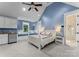 Comfortable bedroom features a vaulted ceiling, built-in window seat, and soft blue walls creating a serene retreat at 16921 Jetton Rd, Cornelius, NC 28031