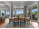 Elegant dining room with hardwood floors and windows offering beautiful lake views at 16921 Jetton Rd, Cornelius, NC 28031
