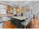 Spacious kitchen features a large island, stainless appliances, and beautiful hardwood floors at 16921 Jetton Rd, Cornelius, NC 28031