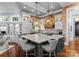 Expansive kitchen with island seating, modern appliances, and brick accents for a chef-inspired design at 16921 Jetton Rd, Cornelius, NC 28031