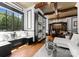 Cozy living room with hardwood floors, built-in bookshelves, and plenty of natural light at 16921 Jetton Rd, Cornelius, NC 28031