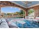 Poolside patio includes lounge chairs, umbrellas, and comfortable seating with lake views at 16921 Jetton Rd, Cornelius, NC 28031