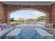 Poolside patio with chairs, umbrellas, and comfortable seating provides beautiful lake views at 16921 Jetton Rd, Cornelius, NC 28031
