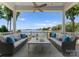 Relaxing outdoor seating on porch offers beautiful lake views and comfortable furnishings at 16921 Jetton Rd, Cornelius, NC 28031