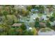 Aerial view of a charming home nestled among trees on a lake, offering privacy and natural beauty at 287 Ben Eller Ln, Taylorsville, NC 28681