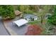 Charming home with a metal carport and lovely landscaping near a serene pond setting at 287 Ben Eller Ln, Taylorsville, NC 28681