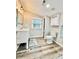 Bathroom featuring a modern white vanity, new light fixture and wood-look floors at 287 Ben Eller Ln, Taylorsville, NC 28681