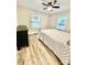 Bedroom with ceiling fan and wood-look floors; lots of natural light at 287 Ben Eller Ln, Taylorsville, NC 28681