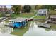 Waterfront home showcasing a covered boat dock with boat and jet ski parking, and peaceful water views at 287 Ben Eller Ln, Taylorsville, NC 28681