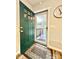 The entryway features a green door, rug, and access to a screened in porch at 287 Ben Eller Ln, Taylorsville, NC 28681