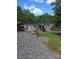 Charming waterfront home with a well-maintained lawn, dock access, and tasteful landscaping at 287 Ben Eller Ln, Taylorsville, NC 28681