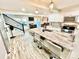 Open concept kitchen with large granite island, bar stool seating, modern appliances, and access to outdoor living space at 287 Ben Eller Ln, Taylorsville, NC 28681