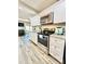 Bright kitchen featuring stainless steel appliances, modern cabinetry, and granite countertops for a stylish cooking space at 287 Ben Eller Ln, Taylorsville, NC 28681