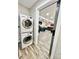 Laundry room leading to the living room, featuring a stackable washer and dryer for convenience at 287 Ben Eller Ln, Taylorsville, NC 28681