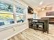 Living room with modern flooring, a breakfast bar with seating, and a large window overlooking the lake at 287 Ben Eller Ln, Taylorsville, NC 28681