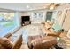 Cozy living room with plush seating, a modern TV setup, and scenic water views through large windows at 287 Ben Eller Ln, Taylorsville, NC 28681