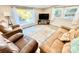 Cozy living room features a view of the lake from a large window and comfortable seating at 287 Ben Eller Ln, Taylorsville, NC 28681