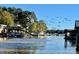 Lakefront houses with docks, complemented by surrounding trees and peaceful water, offering a picturesque natural setting at 287 Ben Eller Ln, Taylorsville, NC 28681