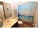 Bathroom with single vanity, shower/tub combo, and ocean-themed decor at 628 Barcroft Ln, Fort Mill, SC 29715