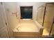 Relaxing bathroom with a large garden tub and a walk-in shower at 628 Barcroft Ln, Fort Mill, SC 29715