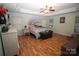 Main bedroom with wood floors, a tree mural, and plenty of light at 628 Barcroft Ln, Fort Mill, SC 29715
