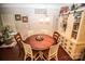 Dining area with round wooden table, four chairs, and built-in storage at 628 Barcroft Ln, Fort Mill, SC 29715