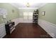 Formal dining room with green walls, wainscoting, and hardwood floors at 628 Barcroft Ln, Fort Mill, SC 29715