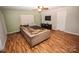 Gathering room with sectional sofa, hardwood floors, and built-in shelving at 628 Barcroft Ln, Fort Mill, SC 29715