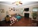 Living room with fireplace, hardwood floors, and comfy seating area at 628 Barcroft Ln, Fort Mill, SC 29715