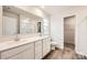 Bathroom with double sink vanity, a large mirror, and a glass-enclosed shower at 110 Dorian Pl, Troutman, NC 28166
