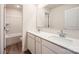 Bright bathroom with double vanity, white cabinets, and a separate toilet and shower area at 110 Dorian Pl, Troutman, NC 28166