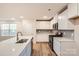 Modern kitchen featuring stainless steel appliances, subway tile backsplash, and a large island at 110 Dorian Pl, Troutman, NC 28166