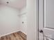 Practical laundry room/closet with wood-look flooring, and a wire shelf at 110 Dorian Pl, Troutman, NC 28166